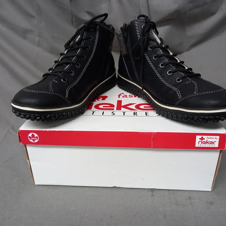 BOXED PAIR OF RIEKER WATER RESISTANT BOOTS IN BLACK SIZE 8