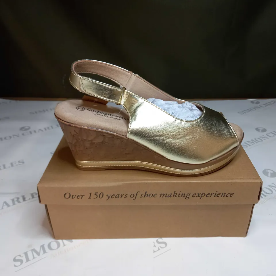BOXED PAIR OF CUSHION WALK GOLD WEDGE HEEL SHOES IN GOLD - SIZE 5