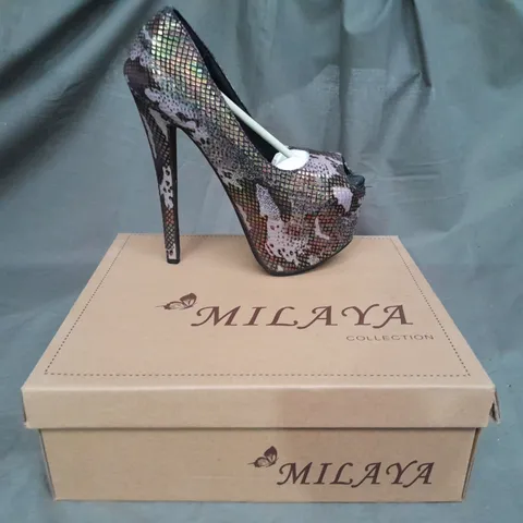APPROXIMATELY 10 BOXED PAIRS OF PLATFORM HEALS VARIOUS SIZES 