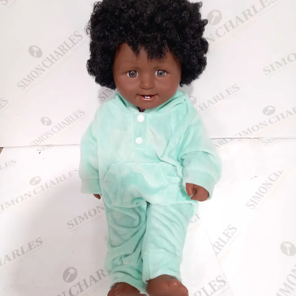 BOXED CURLY-HAIRED DOLL IN GREEN JUMPSUIT - APPROX 50CM TALL
