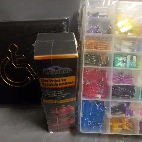 BOX OF ASSORTED CAR ITEMS TO INCLUDE FUSES , DISABLED BADGE HOLDER , STEERING WHEEL COVER / COLLECTION ONLY