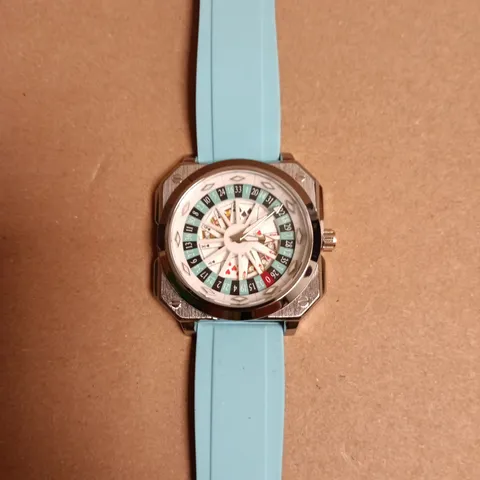 BOXED SCHWARTZBAUER WATCH – STAINLESS STEEL CASE, ROULETTE WHEEL/POKER DETAIL, TURQUOISE SILICONE STRAP