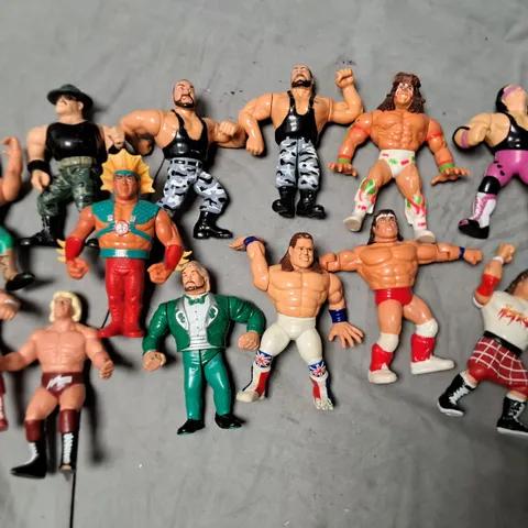 LOT OF 13 ASSORTED WWE FIGURINES