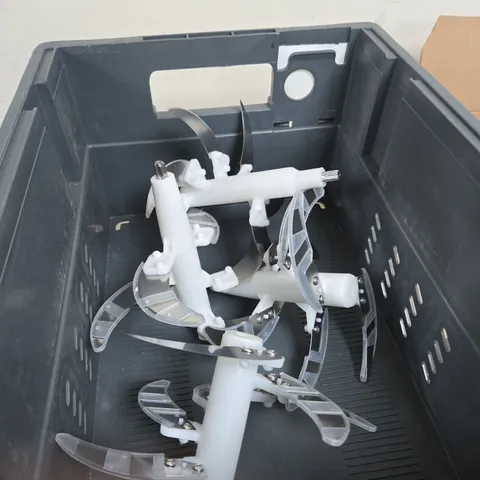 UNIDENTIFIED PLASTIC MECHANICAL COMPONENT WITH CURVED BLADES