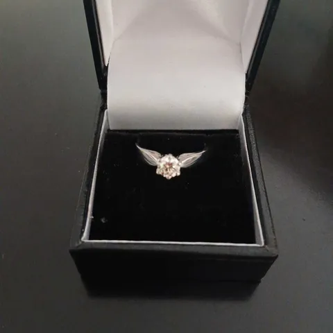 PLATINUM SOLITAIRE RING WITH A NATURAL DIAMOND