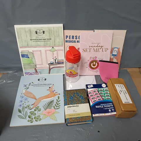 APPROXIMATELY 12 ASSORTED HOUSEHOLD ITEMS TO INCLUDE WATERCOLOUR PAINT BOOK, PAPERBLANKS, RAFFLE TICKETS, ETC
