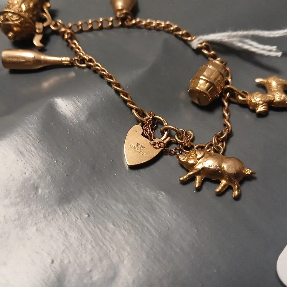 CHARM BRACELET WITH 7 UNIQUE CHARMS - 595 stamp