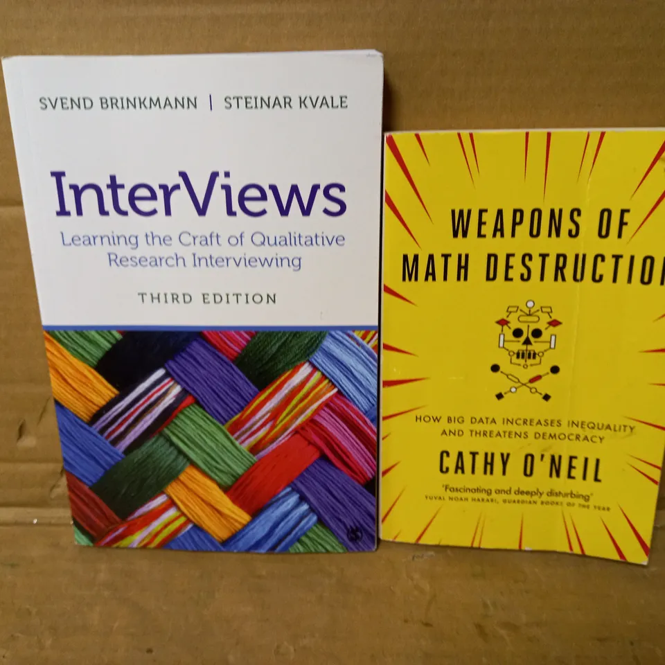 LOT OF 2 BOOKS - "WEAPONS OF MATH DESTRUCTION" BY C. O'NEIL AND "INTERVIEWS" BY S. BRINKMANN & S. KVALE