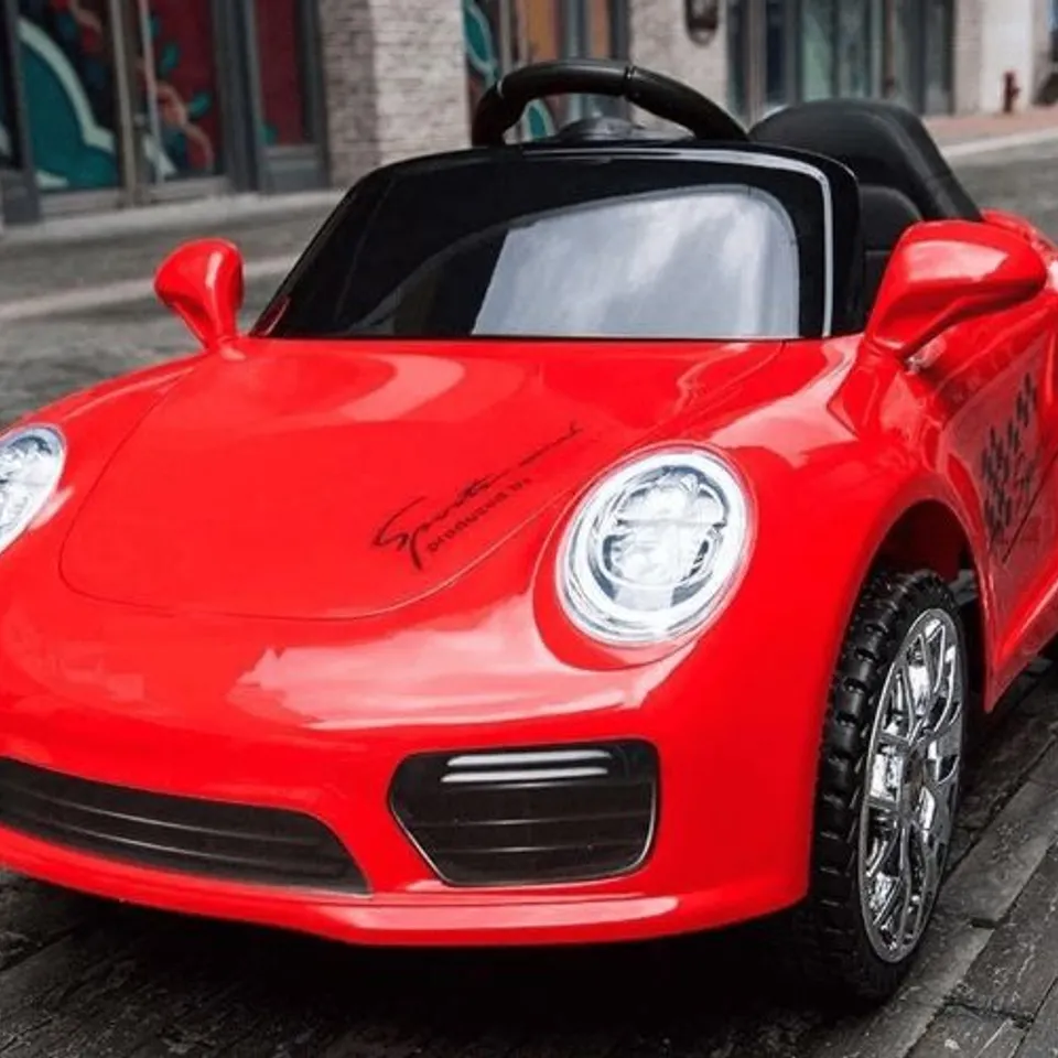 BRAND NEW BOXED KIDS PORSCHE STYLED 12V RIDE ON CAR RED