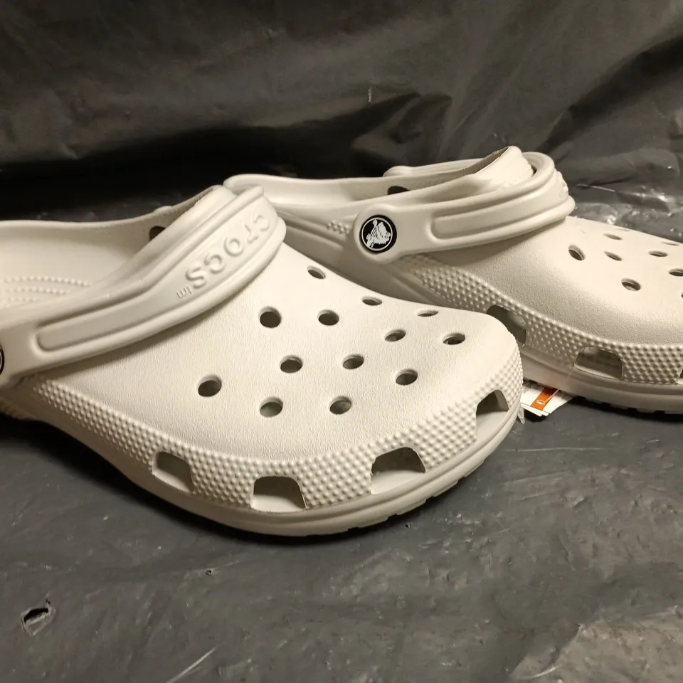 PAIR OF CROCS CLASSIC CLOGS IN GREY SIZE UK M6/W7