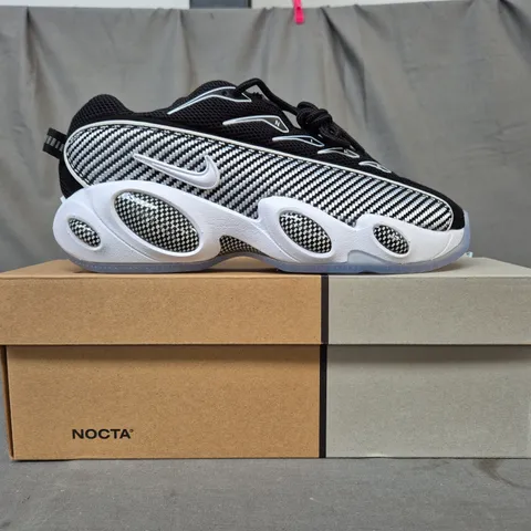 BOXED PAIR OF NIKE NOCTA GLIDE SHOES IN BLACK/WHITE UK SIZE 7