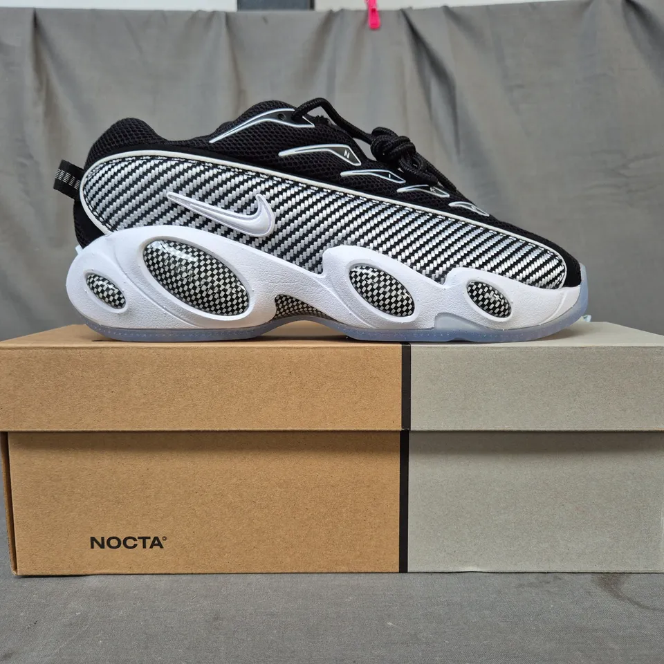 BOXED PAIR OF NIKE NOCTA GLIDE SHOES IN BLACK/WHITE UK SIZE 7