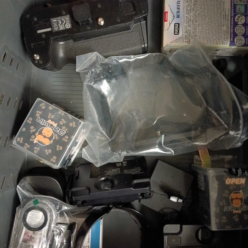 APPROXIMATELY 10 ASSORTED CAMERA ACCESSORIES TO INCLUDE LENS, BATTERY CHARGER, INSTANT FILM ETC 