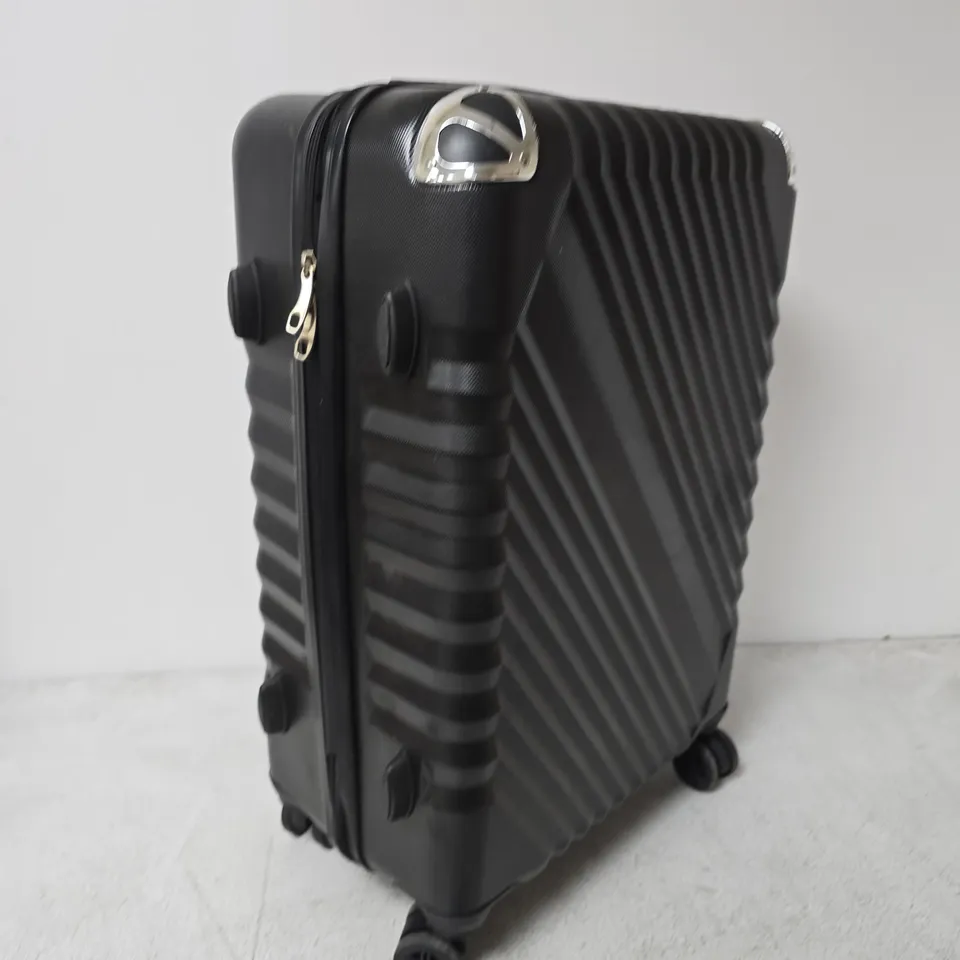 BLACK HARD-SHELL SUITCASE ON FOUR WHEELS