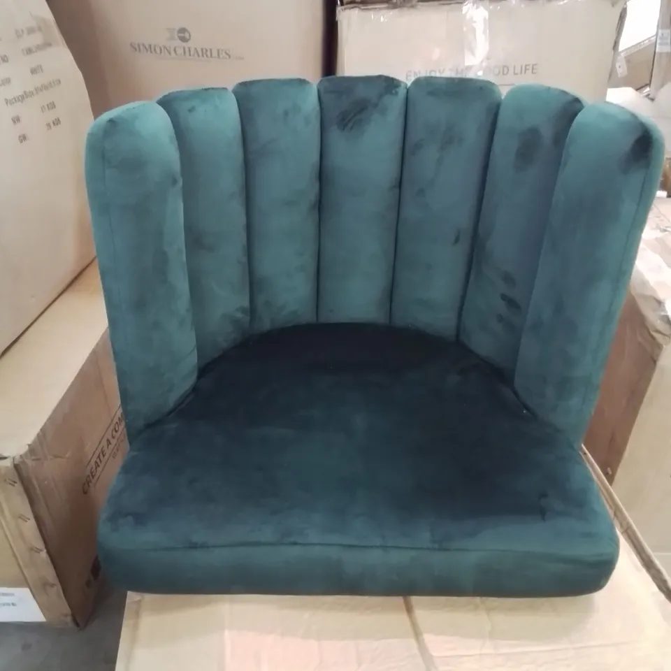 A BOXED GREEN VELVET CURVED BACK CHAIR