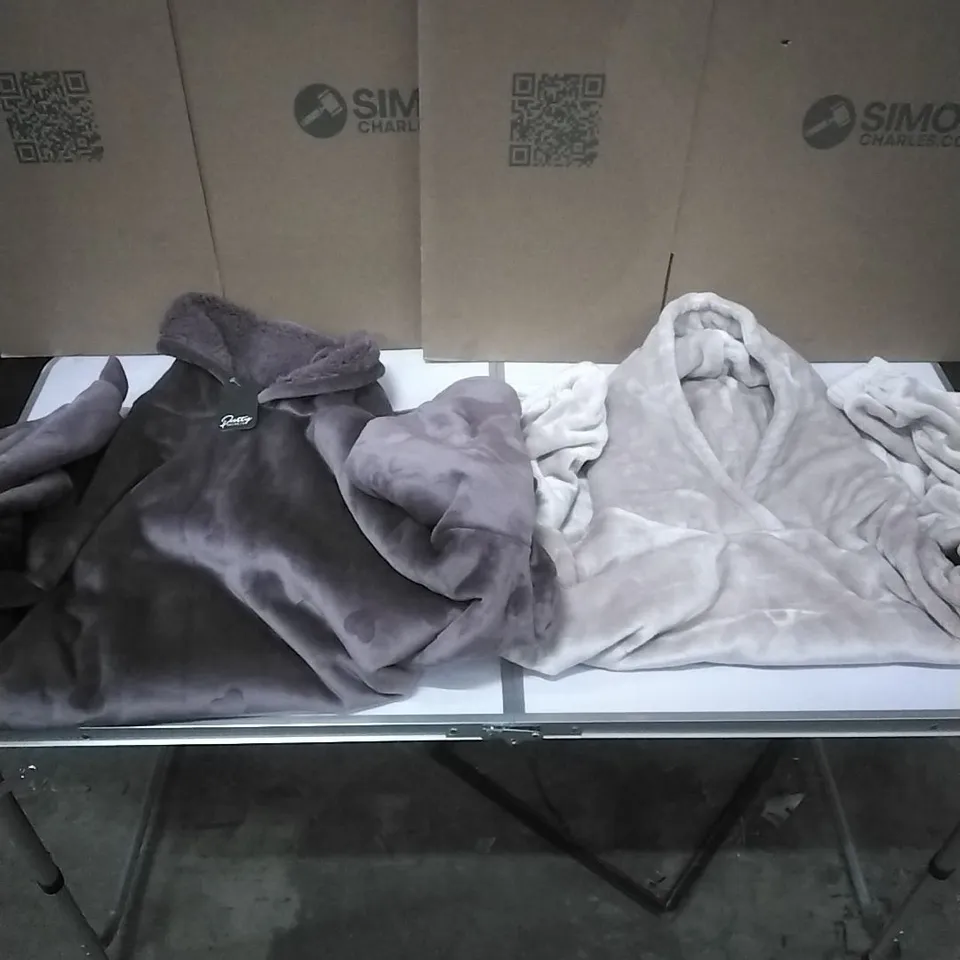 A PALLET TO CONTAIN APPROXIMATELY 65 WOMENS DESIGNER CLOTHES WHICH INCLUDE;PRETTY SECRETS OVERSIZED FLUFFY HOODIES ETC