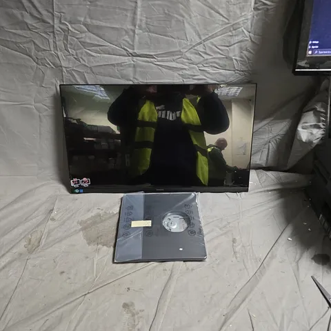 SAMSUNG FLAT SCREEN TV – BLACK 24IN WITH ACCESSORIES AND STAND. SCREEN CRACKED