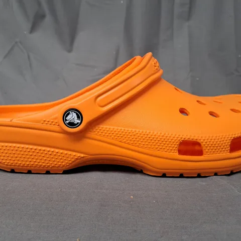 PAIR OF CROCS CLASSIC CLOGS IN ORANGE SIZE M13