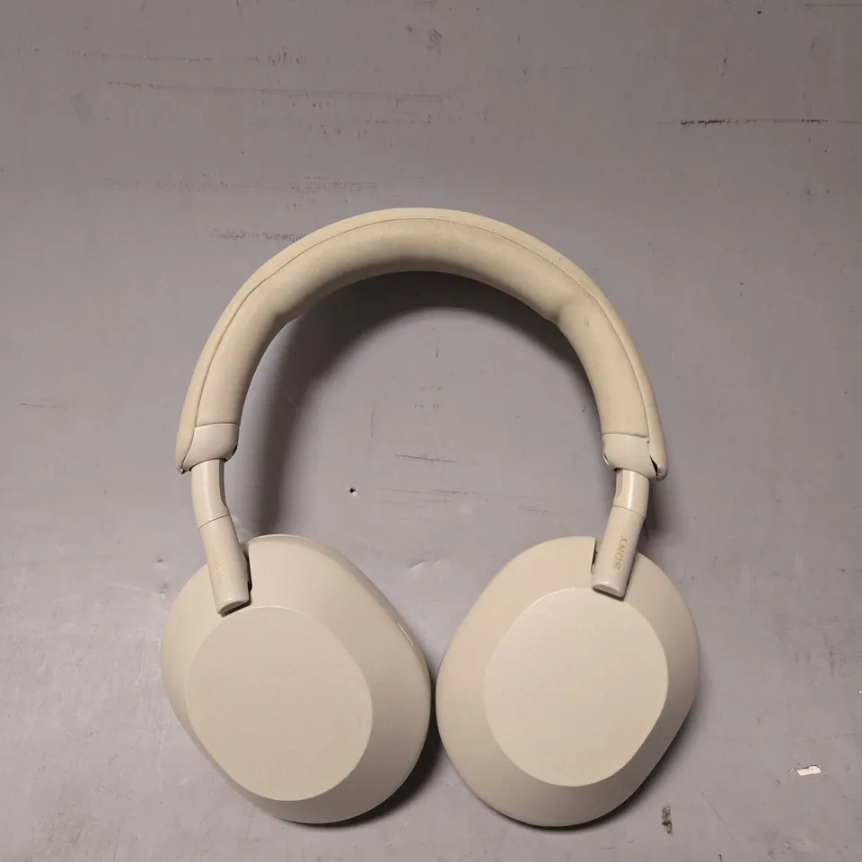 SONY EARPHONES IN BEIGE - MODEL UNSPECIFIED 