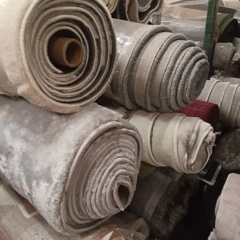 STILLAGE OF ASSORTED QUALITY RUGS APPROXIMATELY 27