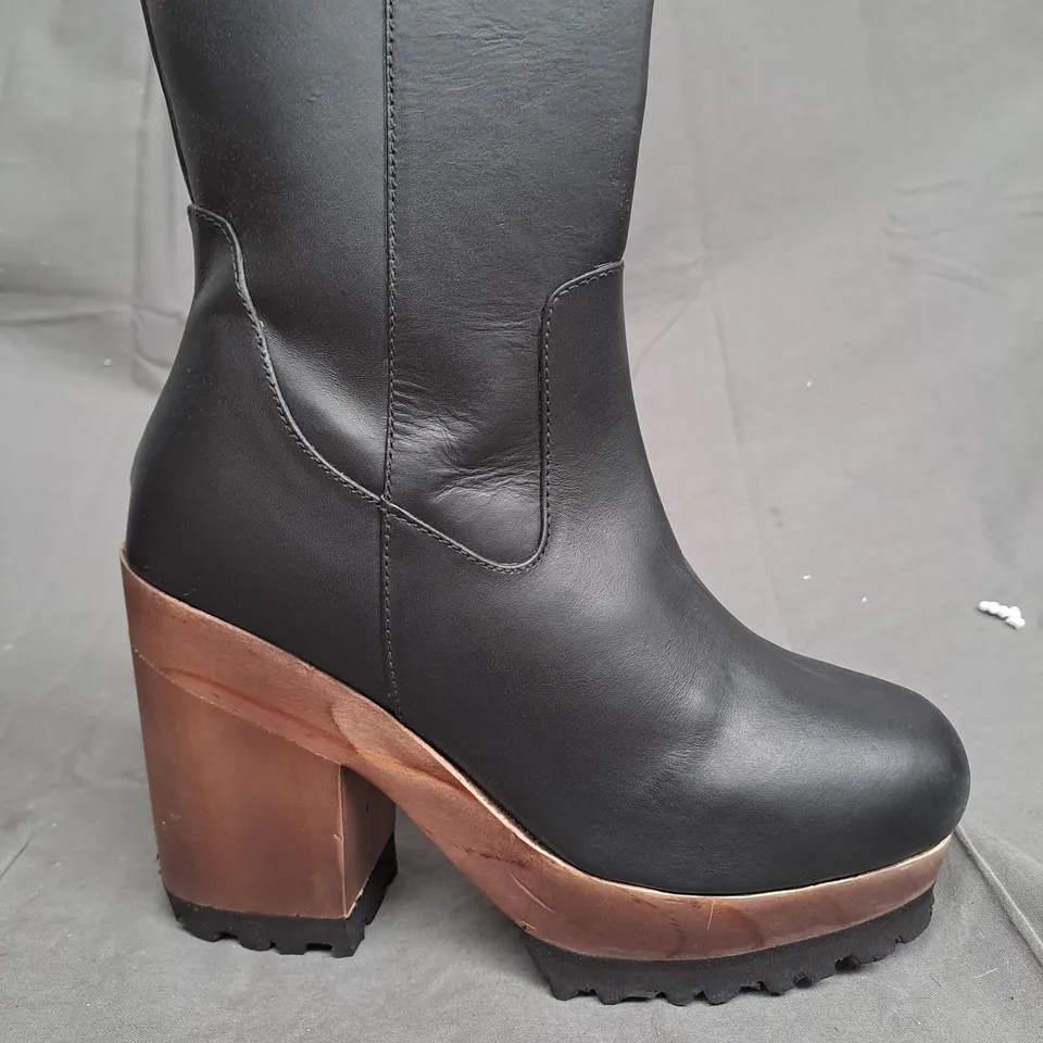 BOX OF APPROXIMATLY 5 WOODEN BOTTOM LEATHER BOOT VARIOUS SIZES 