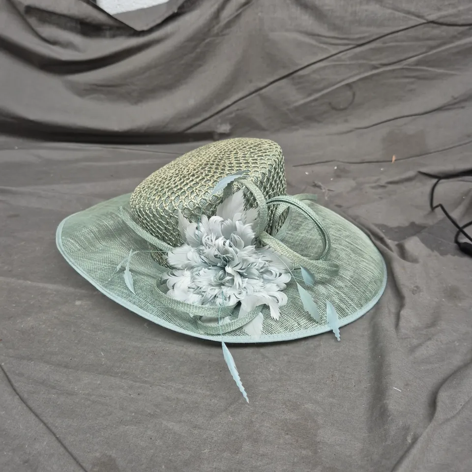 WOMEN'S PALE BLUE-GREEN WOVEN SUN HAT WITH WIDE BRIM AND FLORAL CENTERPIECE