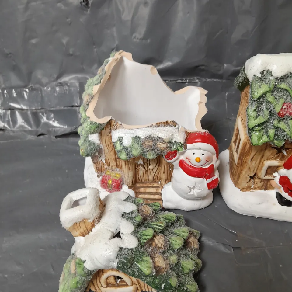 FESTIVE SET OF 2 LIT CERAMIC SANTA/SNOWMAN HOUSE CHRISTMAS DECORATIONS 