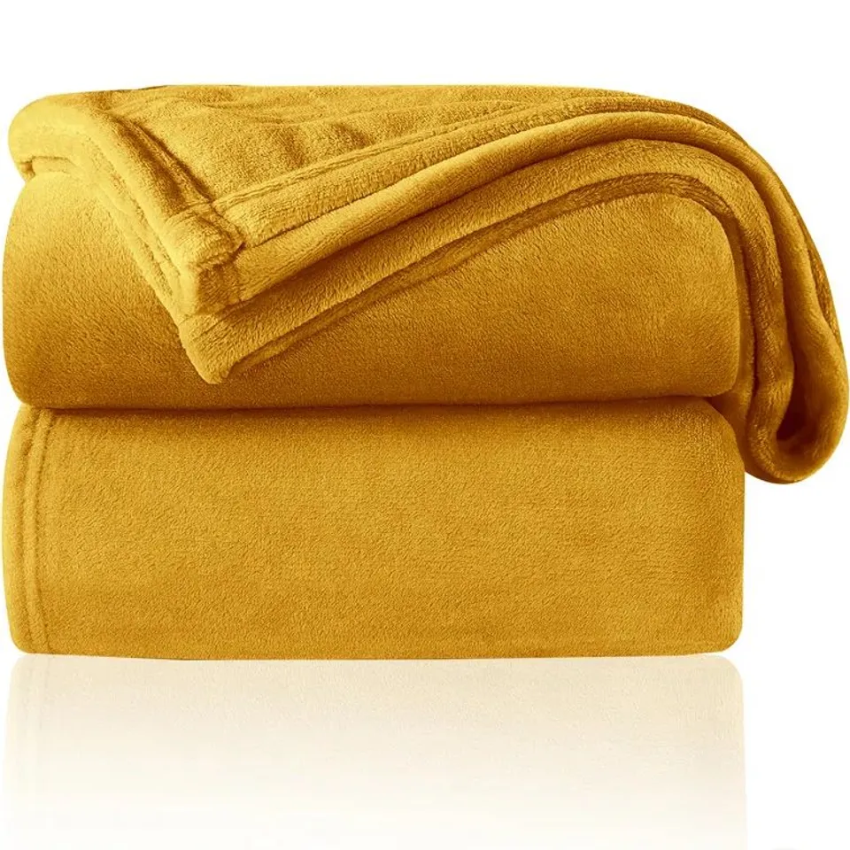 A BOXED ADAMCZYK THROW BLANKET