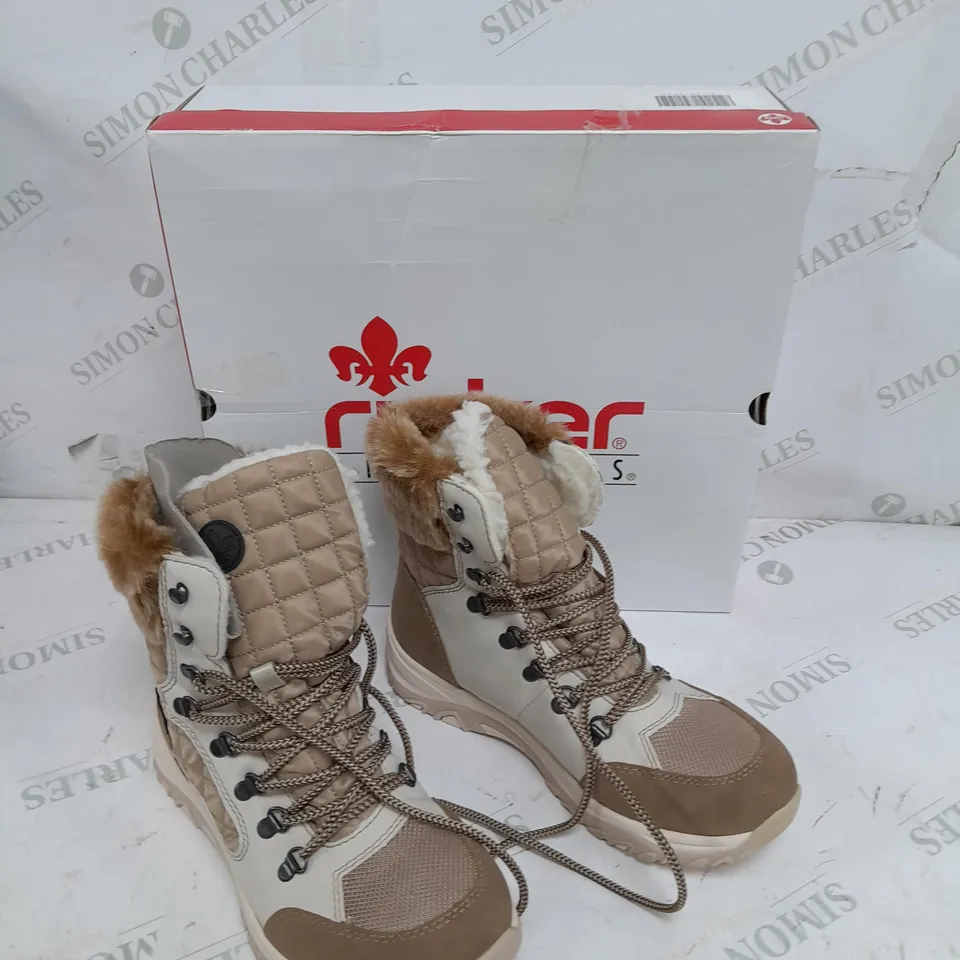 BOXED PAIR OF RIEKER CREAM WINTER FUR HIKE BOOTS IN SIZE 5 