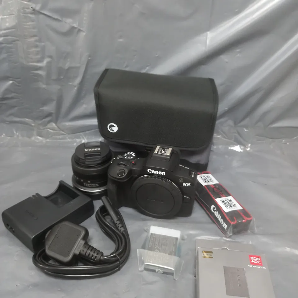 CANON EOS R100 APS-C CAMERA KIT INC RF-S 18-45MM LENS, 32GB SD CARD, ADDITIONAL LP-E17 BATTERY, NECK STRAP & CASE RRP £719