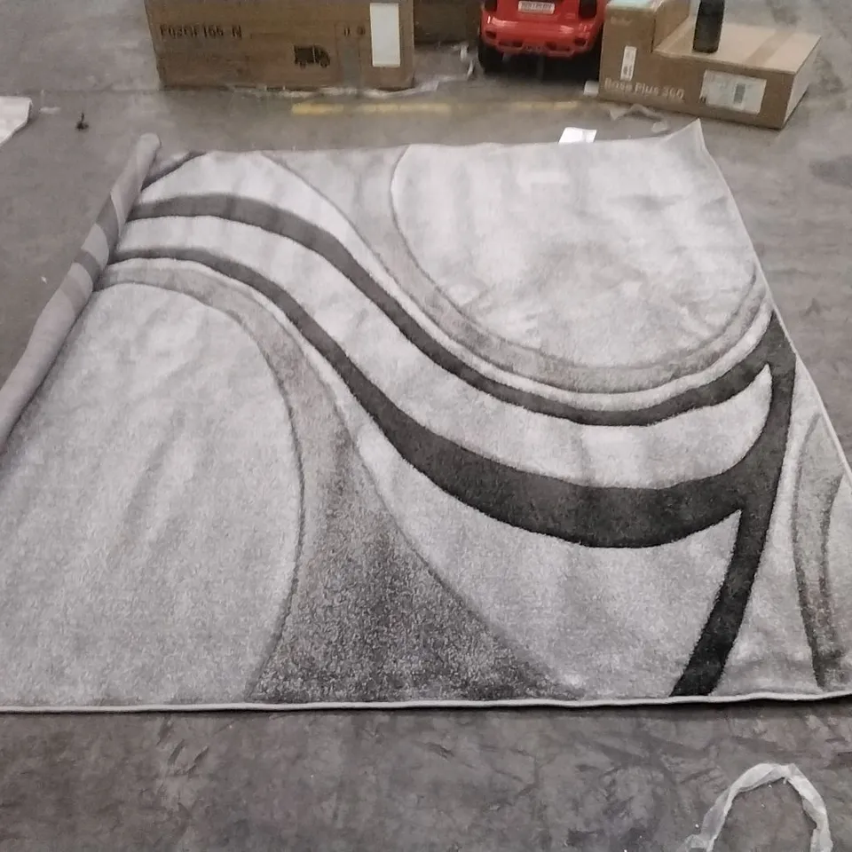 STILLAGE OF APPROXIMATELY 25 DESIGNER RUGS