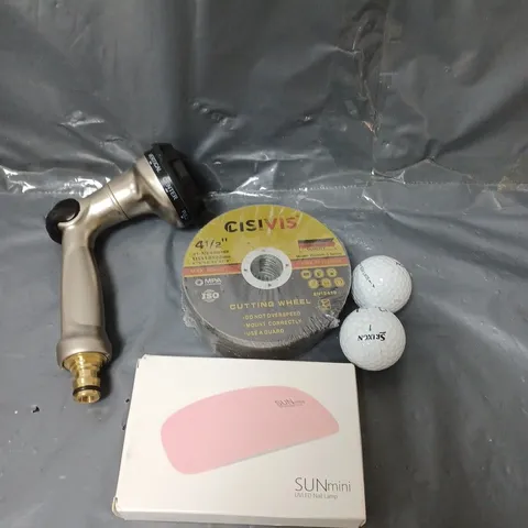 BOX OF APPROXIMATELY 10 ASSORTED HOUSEHOLD ITEMS TO INCLUDE GOLF BALLS, NAIL LAMP AND CUTTING WHEELS