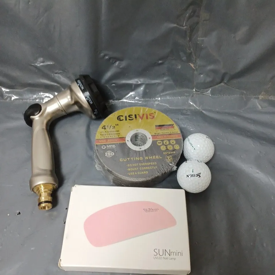 BOX OF APPROXIMATELY 10 ASSORTED HOUSEHOLD ITEMS TO INCLUDE GOLF BALLS, NAIL LAMP AND CUTTING WHEELS 