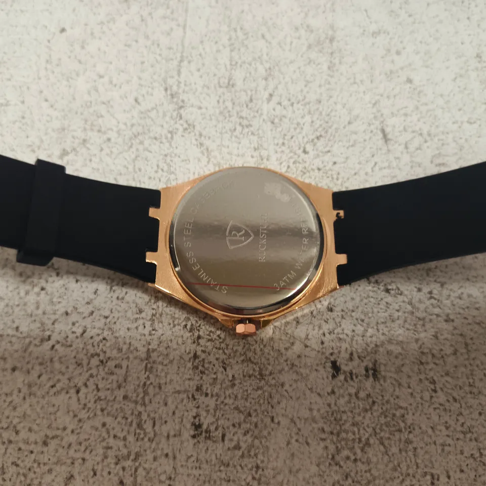 RUCKSTUHL ROSE GOLD-TONE WRISTWATCH – BLACK DIAL, RUBBER STRAP