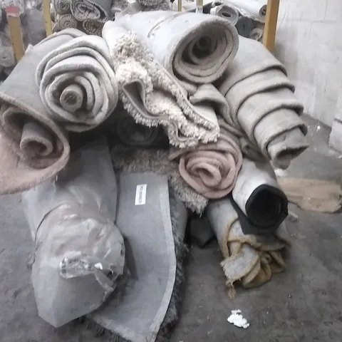 STILLAGE OF APPROXIMATELY 12 DESIGNER RUGS