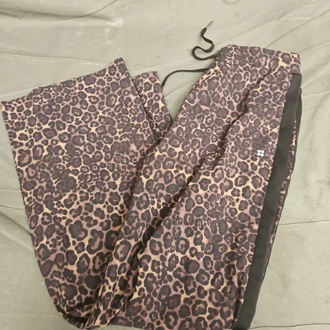 SWEATY BETTY EXPLORER WIDE LEG TAPED 32" TROUSERS IN BROWN WILD LEOPARD PRINT - MEDIUM