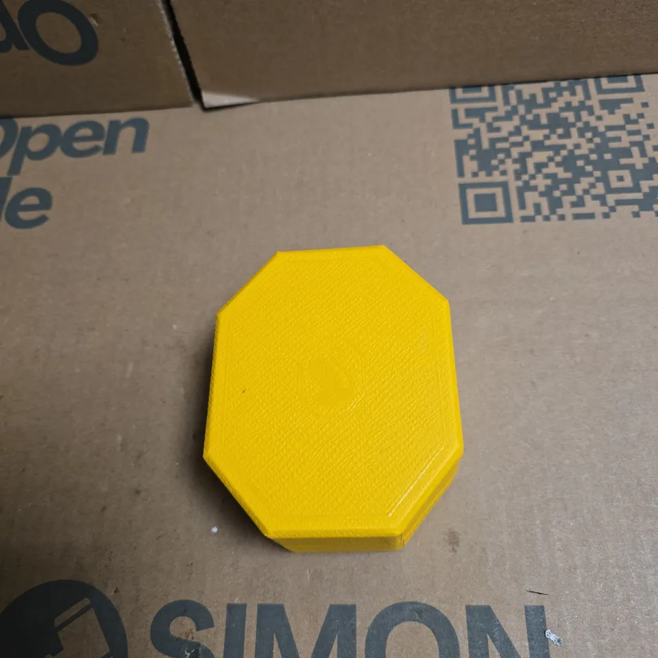 SWAROVSKI TWO SMALL SILVER-TONE EARRINGS WITH CLEAR STONES IN YELLOW OCTAGONAL PRESENTATION BOX