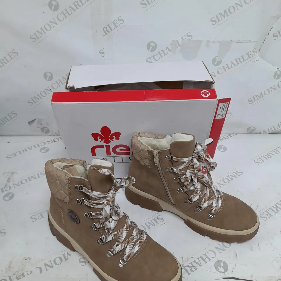 BOXED PAIR OF RIEKER LACE UP CHUNKY BOOTS IN CREAM SIZE 7