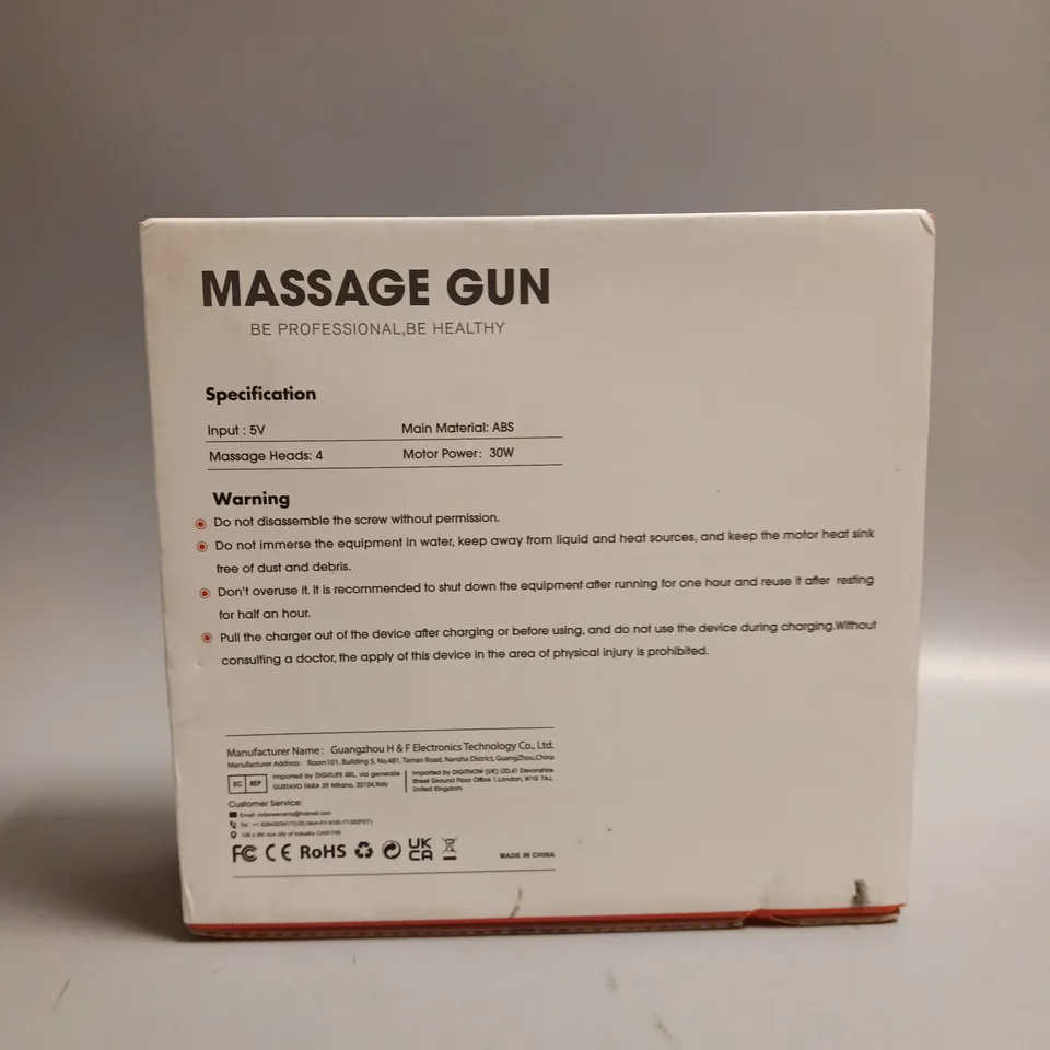 COTSCO MASSAGE GUN IN BLACK WITH GOLD ACCENTS INCLUDES 4 DIFFERENT HEADS AN CHARGING CABLE