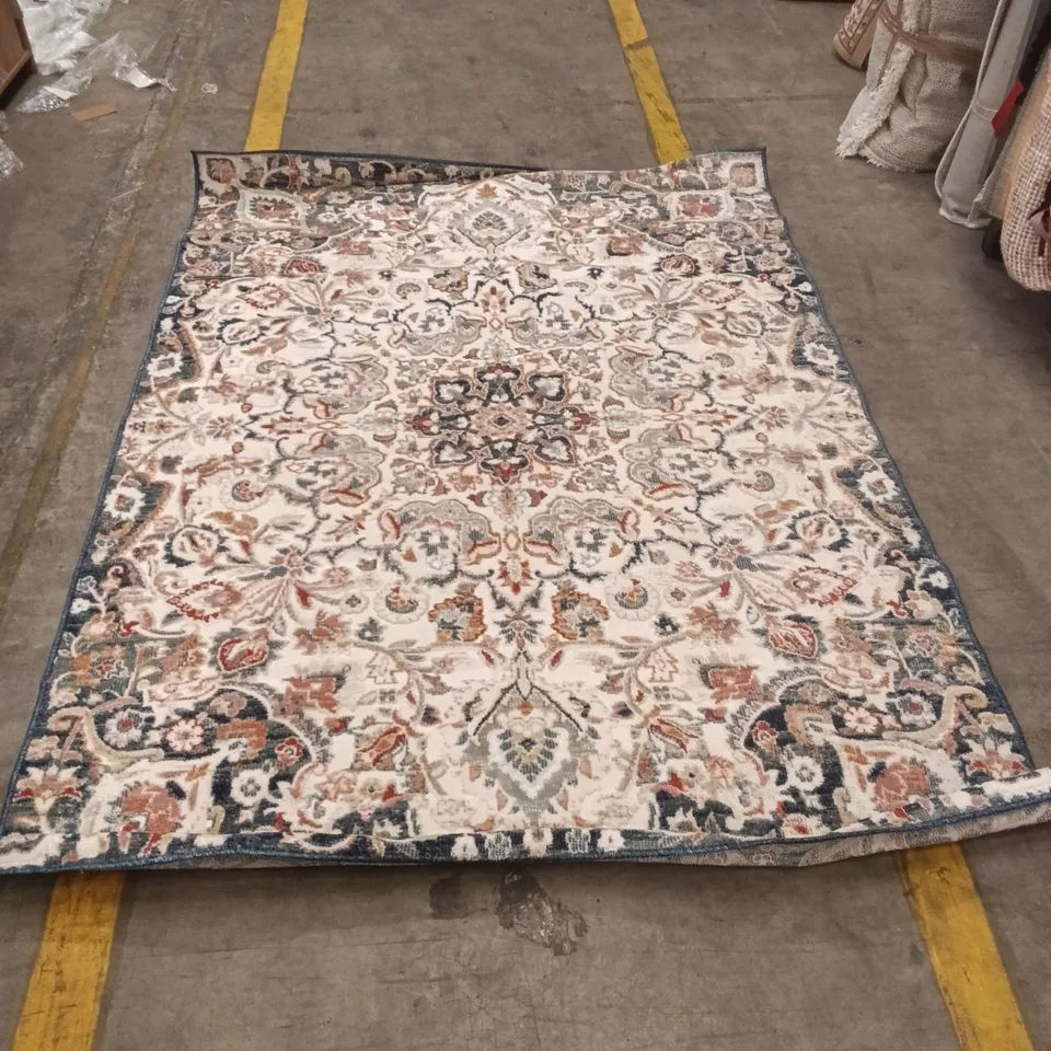 PATTERNED ORIENTAL-STYLE AREA RUG – CREAM WITH BLUE BORDER APPROXIMATELY 220 CM X 156 CM
