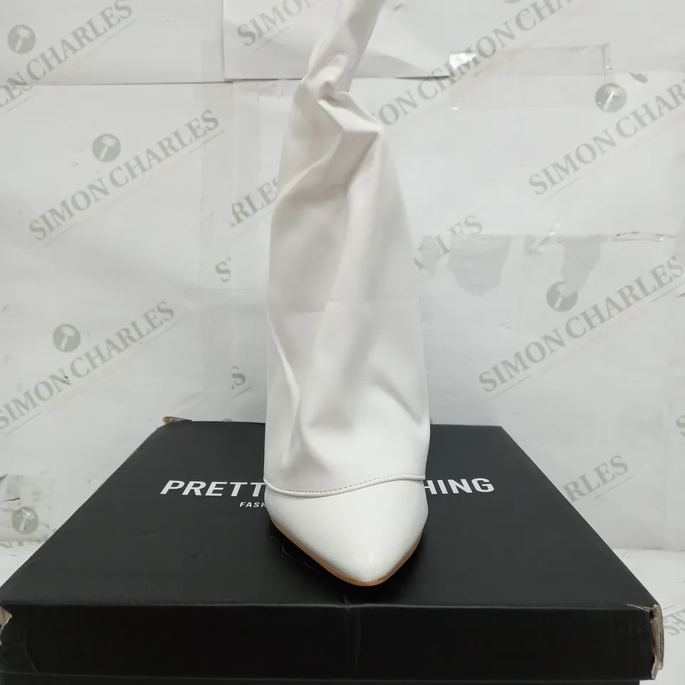 BOXED PAIR OF PRETTY LITTLE THINGS WIDE FIT POINT TOE OVER HIGH HEELED CALF BOOTS IN WHITE - UK 4