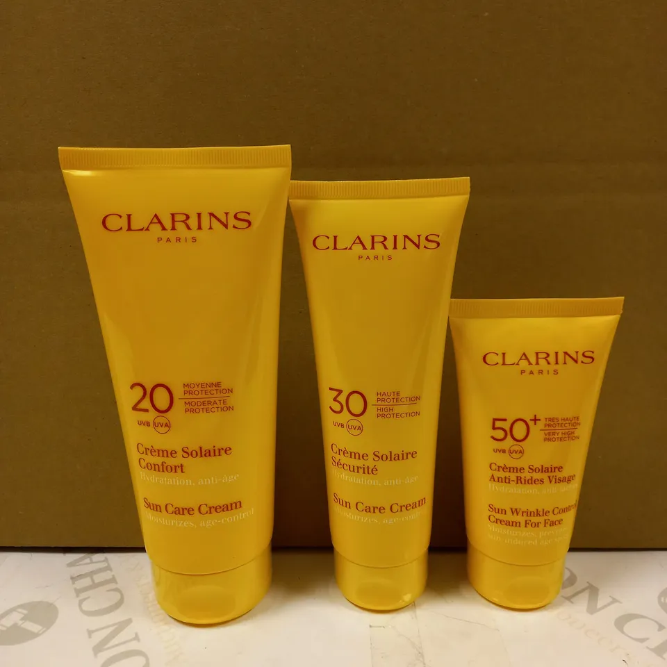LOT OF 3 CLARINS SUN CARE PRODUCTS TO CONTAIN SUN CARE CREAM & SUN WRINKLE CONTROL