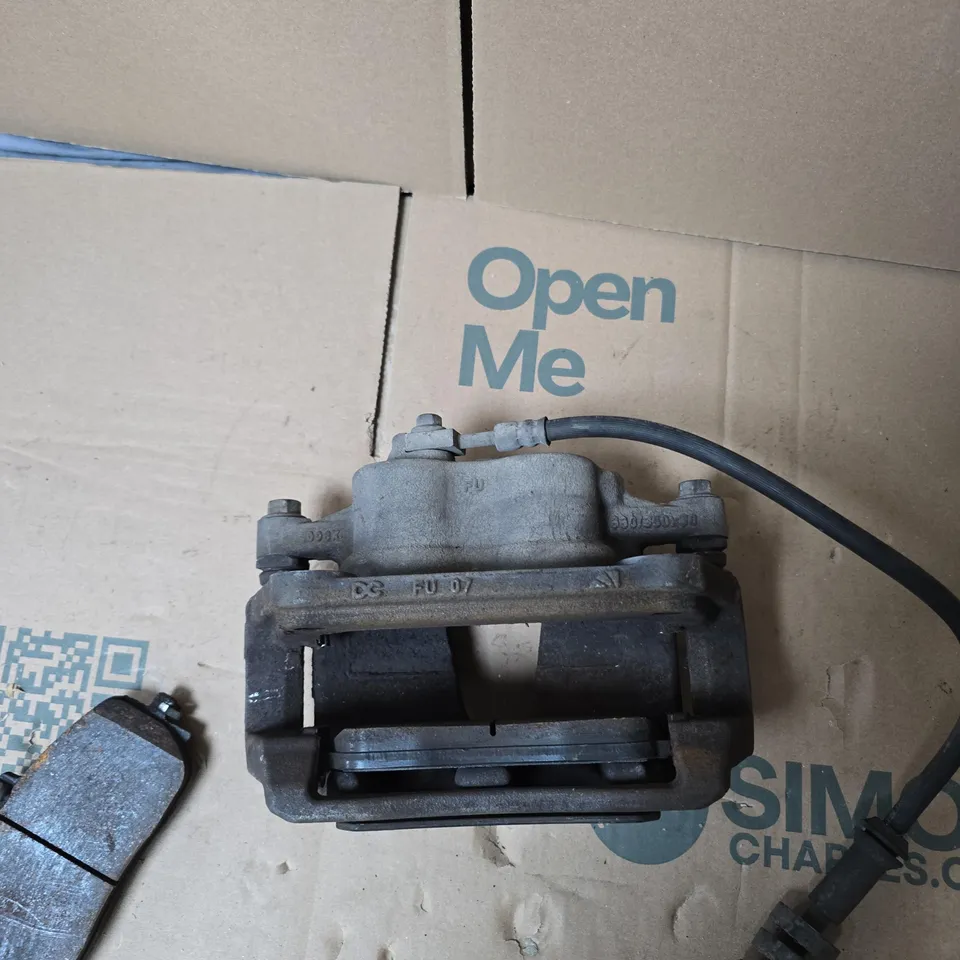 BRAKE CALIPER WITH HYDRAULIC HOSE AND BRAKE PAD – VEHICLE PART