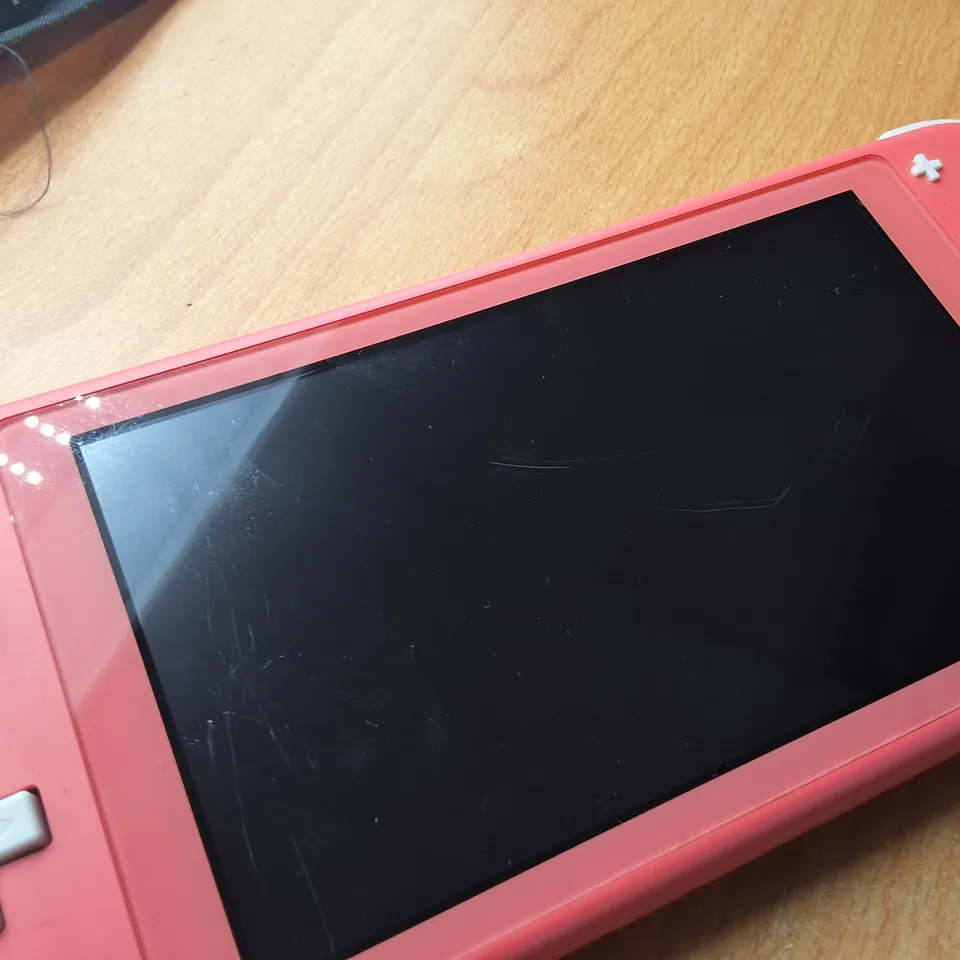 UNBOXED NINTENDO SWITCH LITE IN BLUSH WITH UNIFORM NUMSKULL CASE -HDH-001