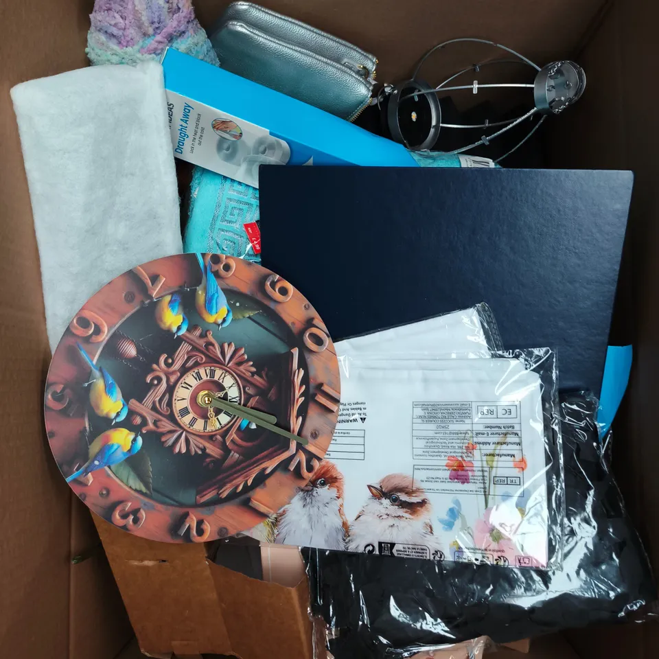 APPROXIMATELY 20 ASSORTED HOUSEHOLD PRODUCTS TO INCLUDE WALL CLOCK, DRAUGHT AWAY, YARN ETC 