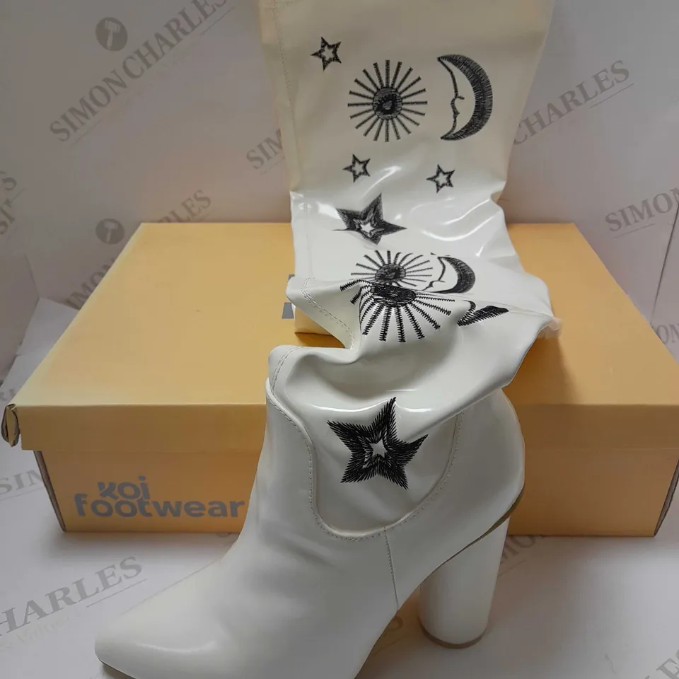 KOI ASTRID STAR AND MOON LONG WHITE PU BOOTS - SIZE 6