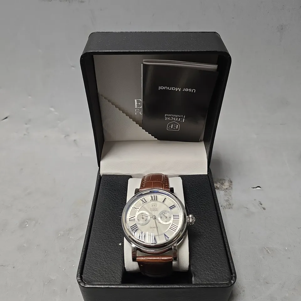 ERNEST FERDINAND WATCH – FUNCTIONING SUB DIALS – LEATHER STRAP – GLASS EXHIBITION BACKCASE