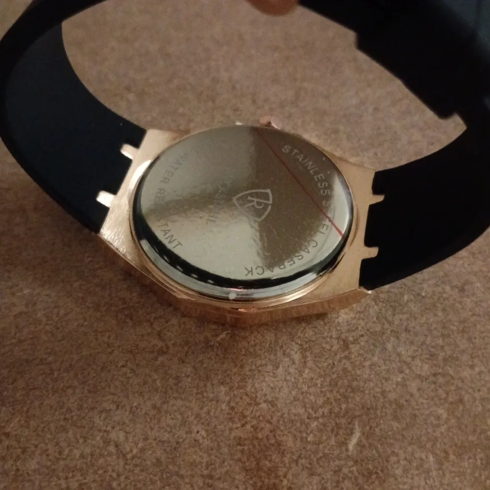 RUCKSTUHL GOLD COLOUR WRISTWATCH WITH BLACK RUBBER STRAP