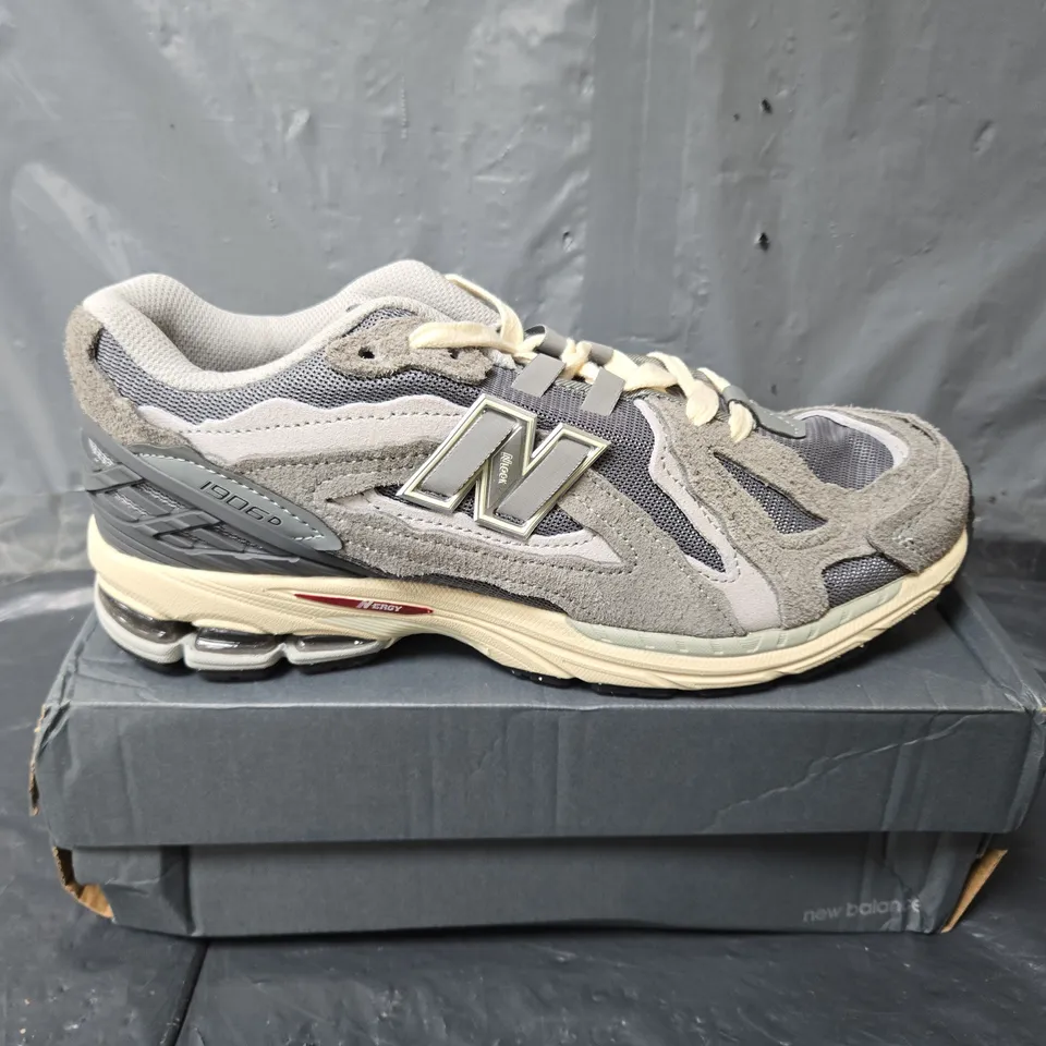BOXED PAIR OF NEW BALANCE 1906D TRAINERS IN GREY - UK 10.5