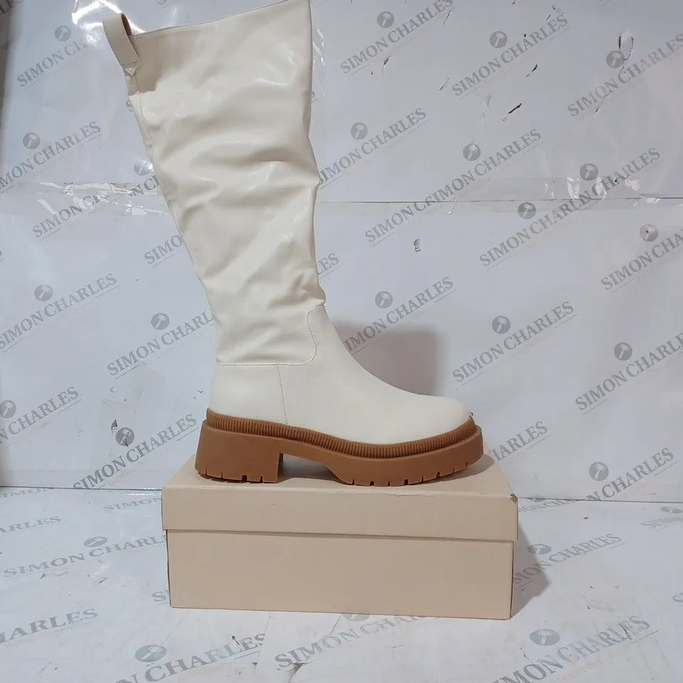 BOXED PAIR OF PUBLIC DESIRE JERSEY BOOTS IN CREAM UK SIZE 6